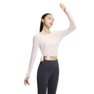 a light pink knotted-front long sleeve crop top