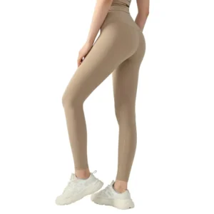 back wearing beige high-waisted leggings