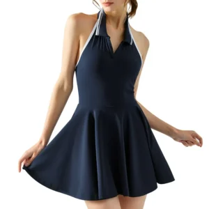 a dark navy blue one-piece swimsuit with a polo shirt collar, halter neck, and an A-line skirt.