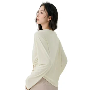 a light cream long-sleeved top