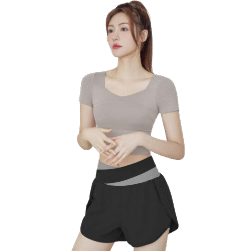 a black athletic two-piece set consisting of a fitted V-neck short-sleeve top and matching shorts with a distinct grey elastic waistband.