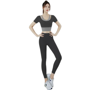 a black and gray color-blocked short-sleeve sports top, matching black fitted leggings