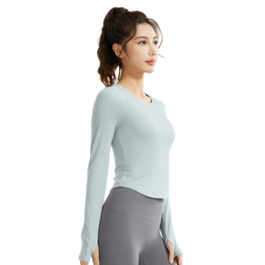 a mint green fitted round-neck long-sleeve top paired with light lavender leggings. The outfit presents a soft, monochromatic athletic look