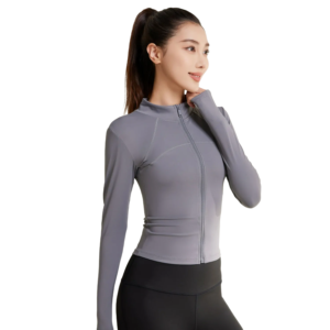 a gray zip-up athletic top with a high collar and thumbhole cuffs, paired with light blue high-waisted workout leggings. The top features a full-length front zipper, and the leggings have subtle contrast stitching along the sides.