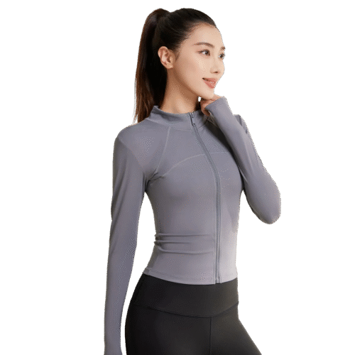a gray zip-up athletic top with a high collar and thumbhole cuffs, paired with light blue high-waisted workout leggings. The top features a full-length front zipper, and the leggings have subtle contrast stitching along the sides.