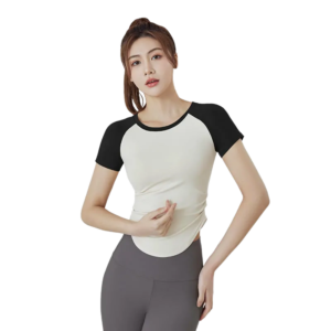 a black and white raglan sleeve T‑shirt. The shirt is white on the body with black sleeves and a black neckline trim