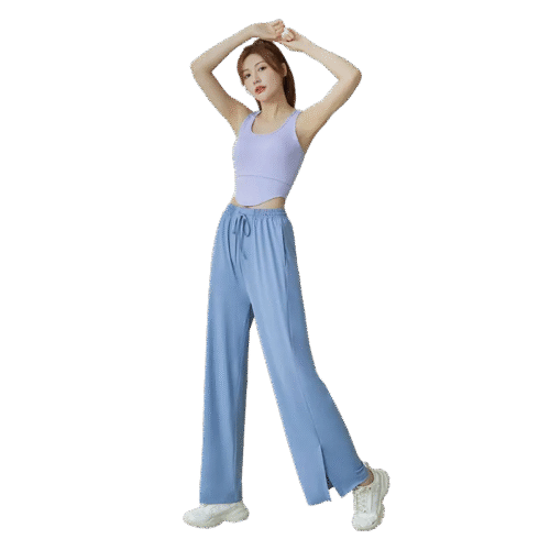 A woman wearing light blue wide-leg pants with an elastic drawstring waist and side pockets.