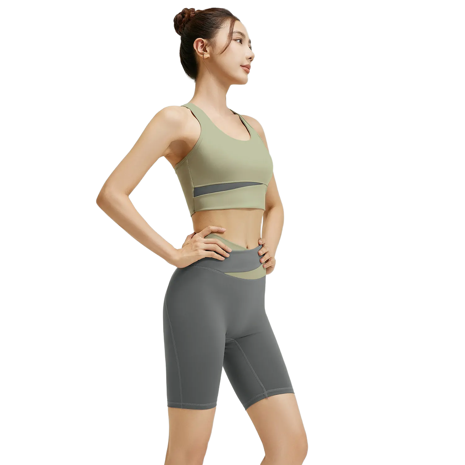 wholesale activewear set in olive green sports bra with cross-front detail and dark grey high-waist shorts with diagonal accent band