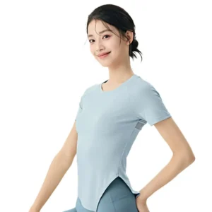 wholesale short sleeve T-shirt in light blue with round neck, asymmetrical hem, and side slit
