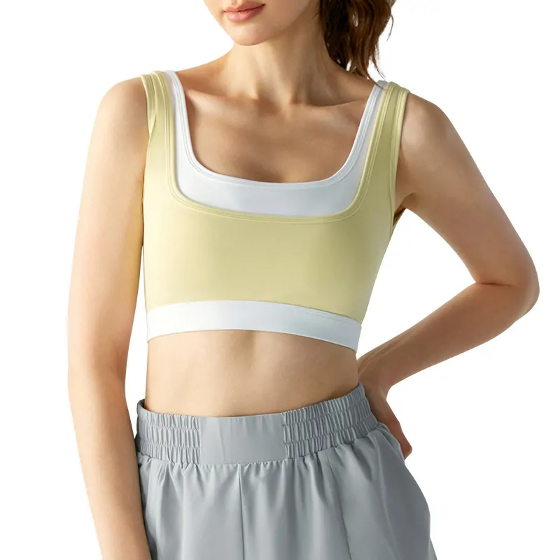 wholesale sports bra in light chartreuse green with white piping and neckline detail