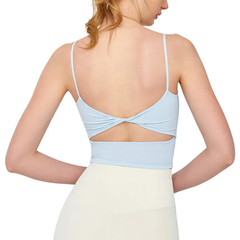 wholesale light blue cross-back sports bra with deep U-back and lace-up detail, model back view close-up on white background