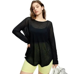 medium-length brown hair wearing a loose black long-sleeve top made of transparent organza or mesh fabric.