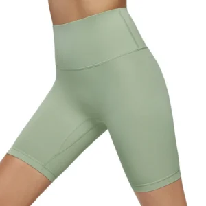 mint green high-waisted workout shorts. The elastic fabric hugs the hips, with simple seam details along the sides.