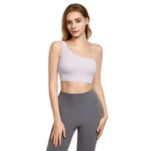 A woman wearing a light purple one-shoulder sports bra