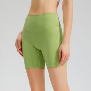 ight green high-waisted athletic shorts. The shorts are made of a smooth, stretchy fabric.