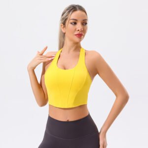 a bright yellow sports bra with wide straps and a high neckline.