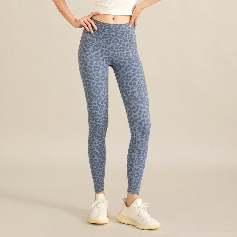 blue high-waisted leggings with a grey leopard print pattern.