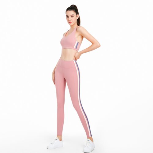 a sleeveless sports bra and high-waisted leggings featuring bold vertical stripes in shades of blue, purple, and white along the sides.