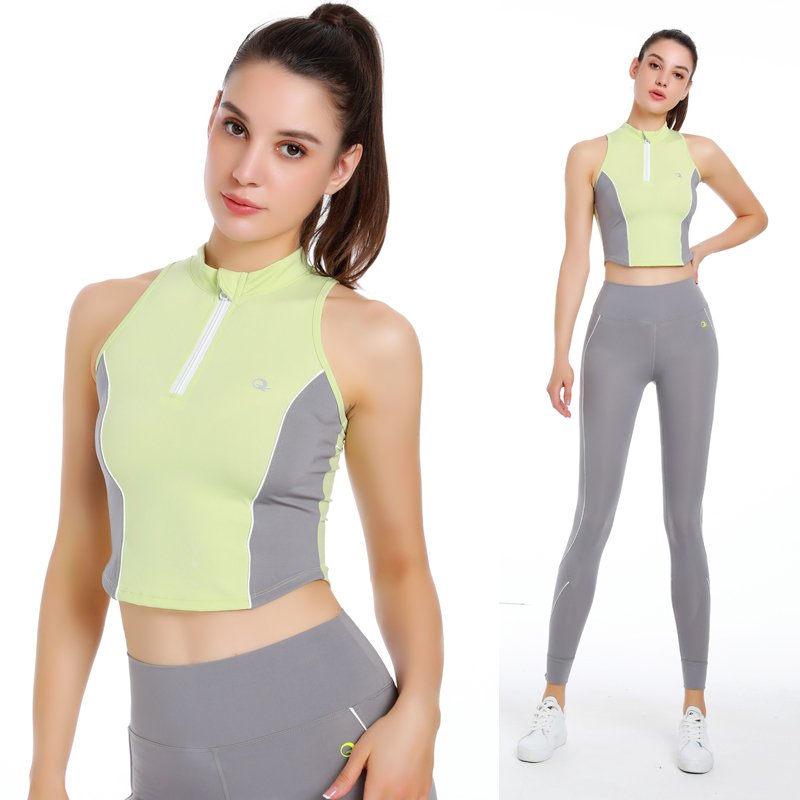 ponytail wearing a yellow-green and grey high-neck sleeveless workout top with a zipper