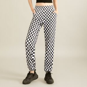 a black crop top and high-waisted black-and-white checkered flared pants