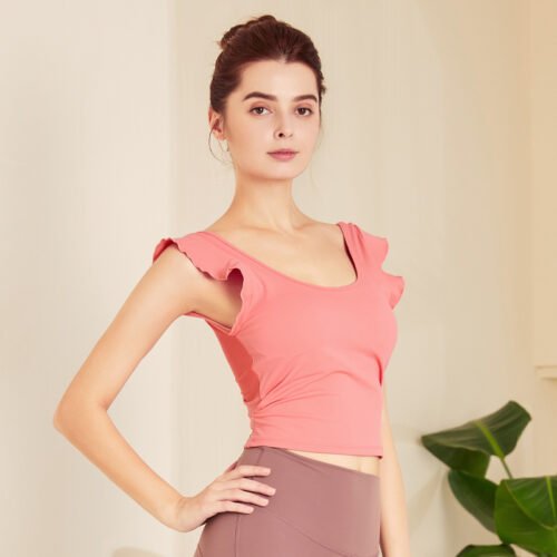 a light pink ruffled crop top