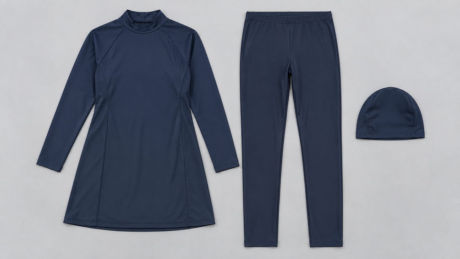 Full-coverage modest swimwear set with a high-neck long-sleeve tunic, full-length leggings and matching swim cap